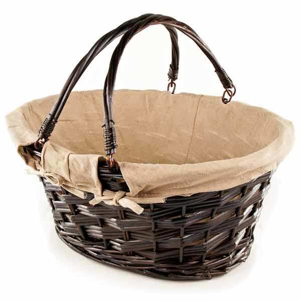 Large brown wicker basket with fabriclined handles